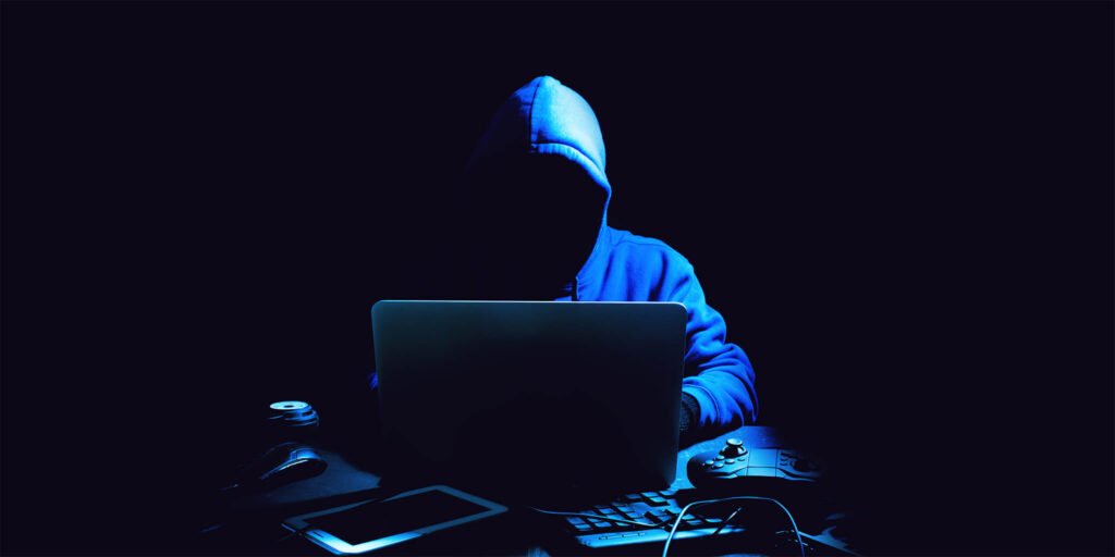 Hacker sitting at computer